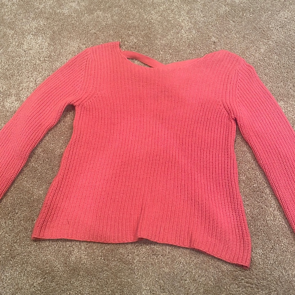 Pink cableknit sweater with criss cross back